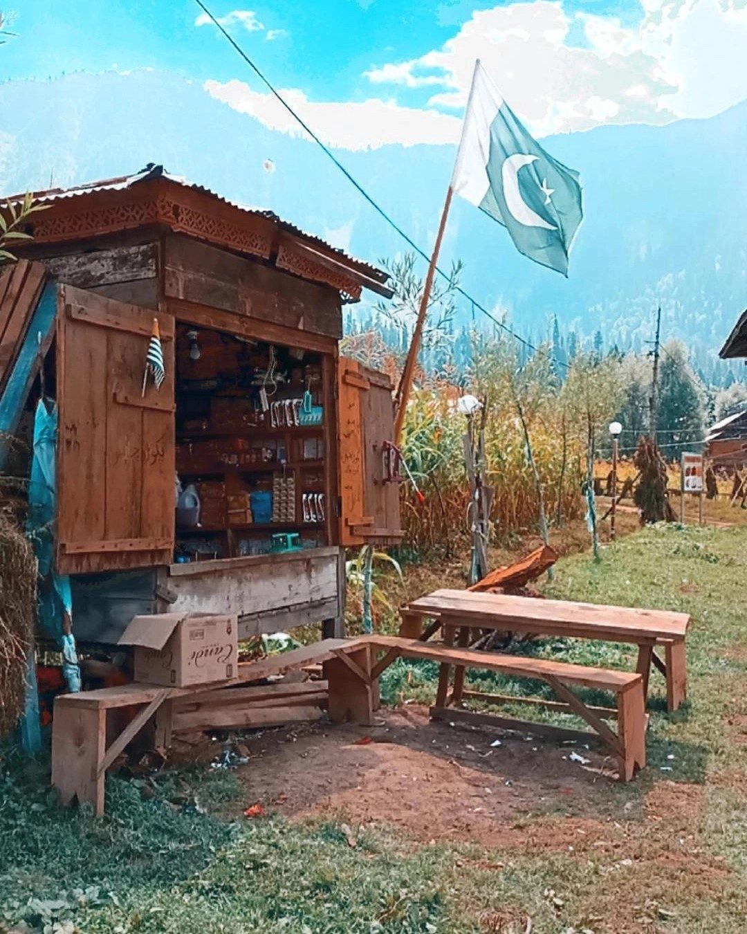 Flag at the Hut — mountains photograph by Muhammad Azeem